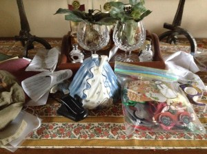 How did this get here? A Fly Girl cap, a booklight, a headless antique, a bag of Christmas tags, a roll of tape