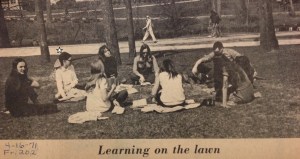 In my Peter Pan collar and box-pleated skirt, sitting on the lawn next to my French instructor with cigarette in her hand.